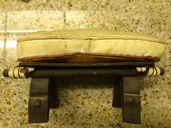 Leather Embr Cushion on Wooden Bench