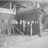 1899 golf clubhouse/logcabin with Ditson & Watson Clubs, Tennis racquets ?