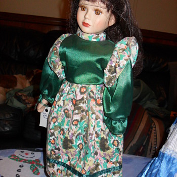 heres three porcilain dolls from my collection