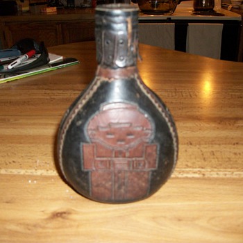 embossed leather wrapped bottle  history