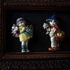 Flower children antique china brooches.