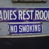 Porcelain No Smoking and Womens rest room signs