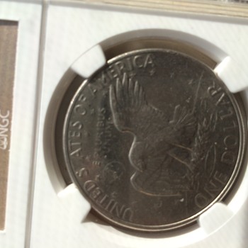1972D Ike Dollar AU 58 with strike thru mint error. - US Coins