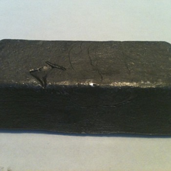 Lead...Pewter.....don't think it's Silver, or Junk?