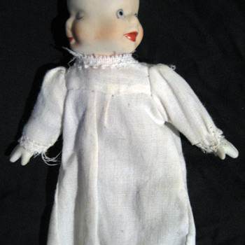 Three-Faced Doll with bisque head and hands