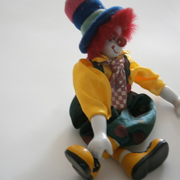 Porcelain sitting Dangling Clown Doll