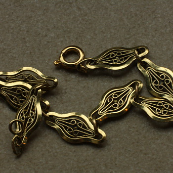 Gold colored filigree bracelet - Costume Jewelry