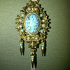 Vintage gold tone turquoise and faux pearl pendant/brooch on chain.