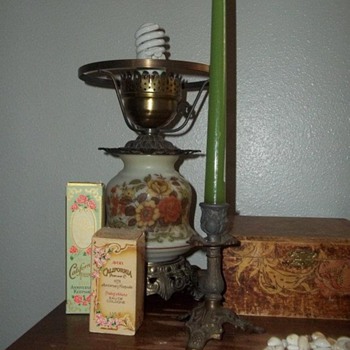 Antique Sewing Machine with Jewelry Boxes, Avon Cologne Bottles, and Lamp and Candlestick - Lamps