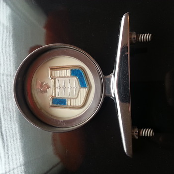 Please help! I collect vintage hood ornaments, but have no clue what this belongs to.