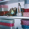 Valentino97 poses w/quilted boxes, shoes & St. Theresa.