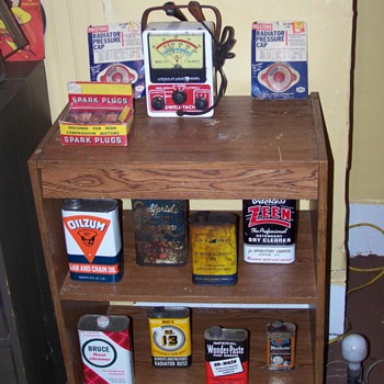 oil cans and spark plugs  - Petroliana