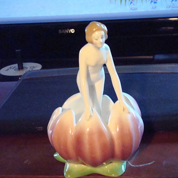 Woman in flower bud figurine. - Art Pottery