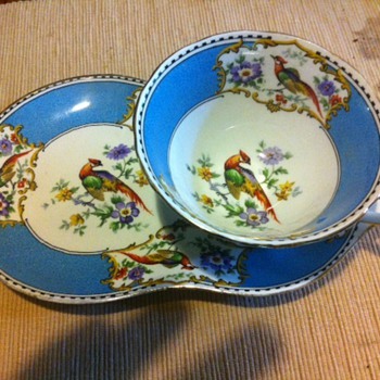 Tea cup and oddly shaped saucer - China and Dinnerware