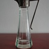 Brass and glass liqueur jug with green edges