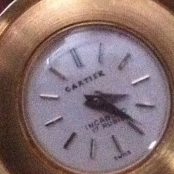 Need some help with this item.......anyone knows anything? I know its a Cartier watch....18k o750..!!!