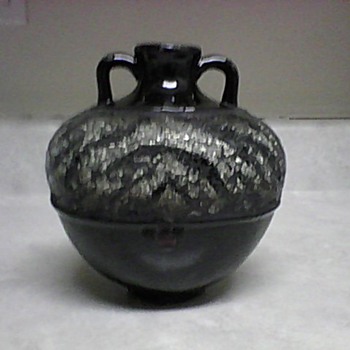 POTTERY VASE WITH A ZEBRA CUT GLASS DESIGN