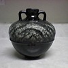 POTTERY VASE WITH A ZEBRA CUT GLASS DESIGN