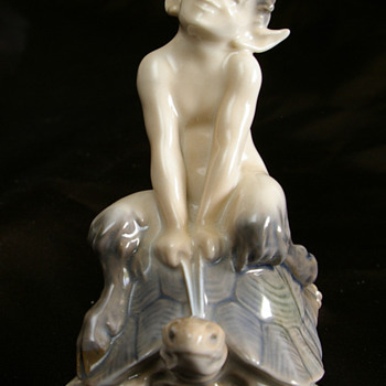 F.X. LEYENDECKER AND A ROYAL COPENHAGEN FAUN