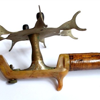 Old steel rod with bakelite handle and open reel