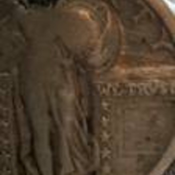 Close up to help magnify the Standing Liberty Quarter with the letter P on it.