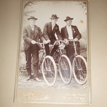 Cabinet card of three Wisconsin bicycle riders c. 1890s