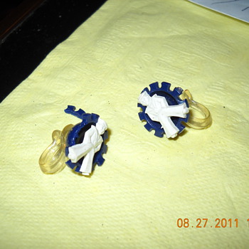 earrings with a salior that looks like the cracker jack guy.