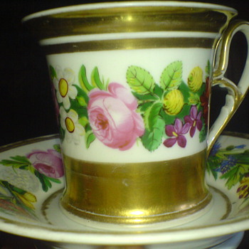 An old china cup , hand painted and elegant romantic design