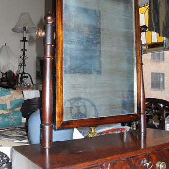 An late 19th century mahogany toilet mirror