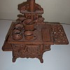Cast iron(?) stove with pots and pans