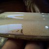 Old pottery plate with a butterfly