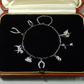 Help identifying maker of Art Deco Platinum and Diamond Charm Bracelet - Art Deco