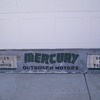 vintage mercury outboard motor sales & service storefront sign