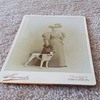 Cabinet card of woman with dog c. 1885
