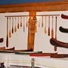 antique model canoe, kayak and miniature paddle displays