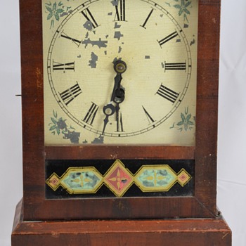 Antique Wooden Mantel Clock with Geometric Designs Maker Unknown
