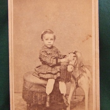 CDV of boy in dress with rocking horse