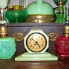 Vidrio Cadillac Clock flanked by two small Pittsburgh satin glass oil lamps