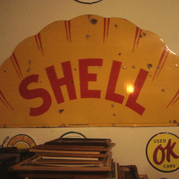 The Shell sign had to be bolted.  Bought for only $90 years ago at an auction but moving it waqs the high price of buying it.,
