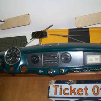 Guess what make of car this is dashboard now wall hanging comes from?