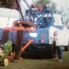 My favorite wrecker ,my pedal tractor and some little punk!