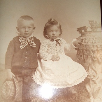 Cabinet card of children with toy train