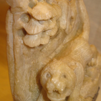 TIGER FIGURINE NOT SURE WHAT IS MADE OF?