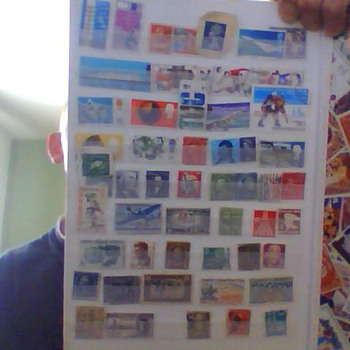 english and us stamps two books full all diffrent sorts all over world, then theres the picture mirror and theres the row i th - Coca-Cola