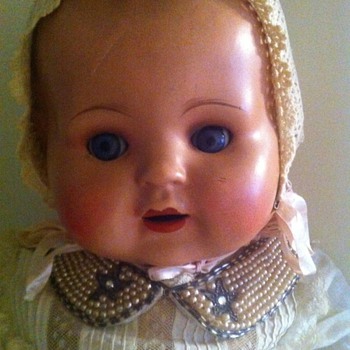 hard plastic dolls , one with cloth body