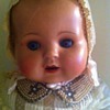 hard plastic dolls , one with cloth body