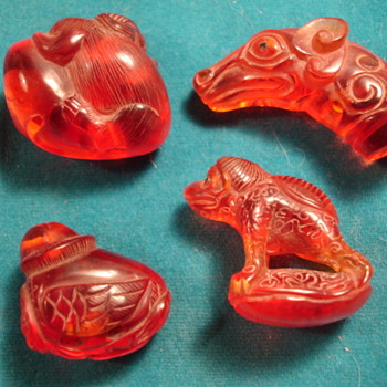 3 Netsuke and a dragon head stamp -any idea what they could be made of?