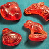 3 Netsuke and a dragon head stamp -any idea what they could be made of?