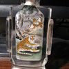 Chinese reverse painting of tigers inside glass snuff bottle