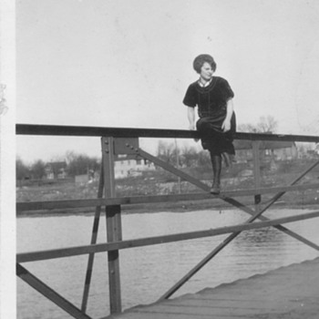 Sitting on a bridge rail ! My grandma 1917-1920 . Pretty brave :-) - Photographs